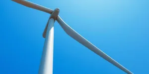 Modern wind turbine against a clear sky.